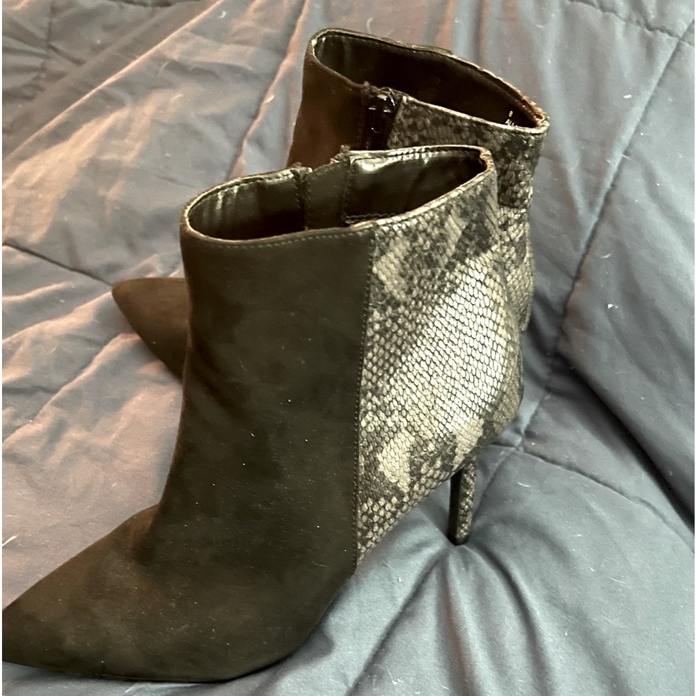 Black and snakeskin ankle boots